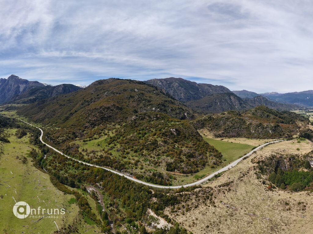 A dirt road leading into the land parcel