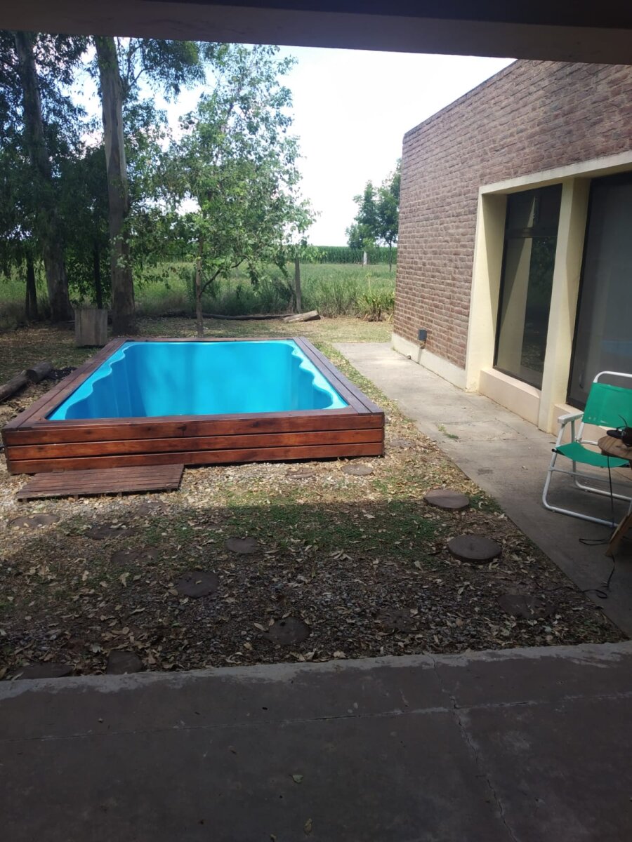 VENTA CASA UN DORMITORIO Y COMODÍN PISCINA EN CAMPO TIMBÓ - 11